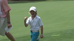 Lucas, moments after he won the tournament. In this picture is smiling at his dad John and getting ready to receive his first-place trophy. Chip Away helped him become the golfer he is now. Lucas is the Bogey to Birdie Man!